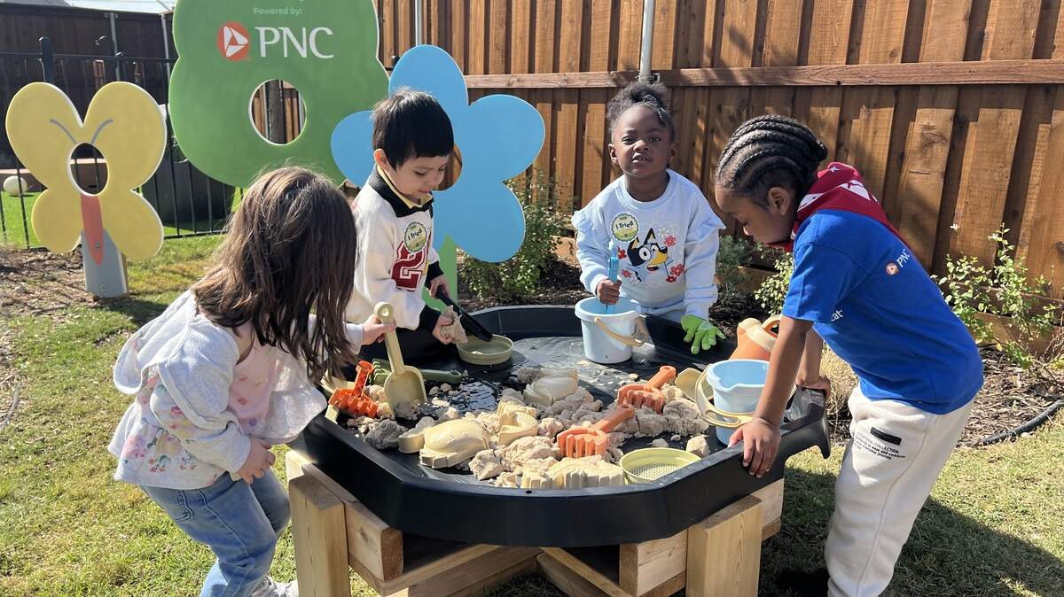 A group of 3- and 4-year-old students play with sand and water at a sensory table in the outdoor learning area of the Child Care Studio at Rise in Fort Worth’s Las Vegas Trail neighborhood on May 7, 2026. A group of 3- and 4-year-old students play with sand and water at a sensory table in the outdoor learning area of the Child Care Studio at Rise in Fort Worth’s Las Vegas Trail neighborhood on May 7, 2026.